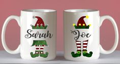 two white coffee mugs with christmas designs on them