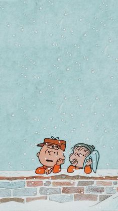 two cartoon characters sitting on top of a brick wall in the snow, one looking at another