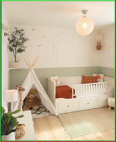 a child's room with a teepee tent and stuffed animals