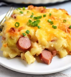 a white plate topped with ham and cheese casserole