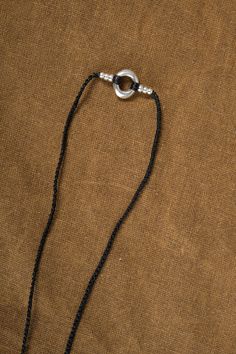 This unique Birdbone on Long Gortex Necklace by Jill Platner features sterling silver pieces stacked on a crocheted cord for a statement-making look. The O-ring clasp adds a touch of functionality to this handcrafted piece, which may vary in size and color, making each necklace a one-of-a-kind creation. Elevate your style with this expertly crafted necklace. Everyday Nylon Cord Jewelry, Silver Lariat Jewelry With Adjustable Cord, Everyday Nylon Cord Bracelet, Everyday Bohemian Nylon Cord Jewelry, Artisan Silver Jewelry With Adjustable Length, Handmade Minimalist Jewelry With Waxed Cord, Artisan Hand Knotted Adjustable Jewelry, Adjustable Pendant Jewelry With Sterling Silver Clasp, Adjustable Sterling Silver Amulet Jewelry