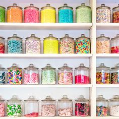 the shelves are filled with many different types of candy