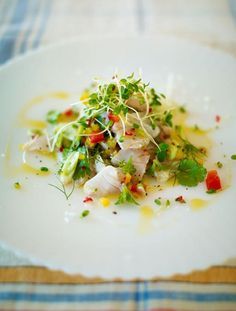 a white plate topped with food on top of a table