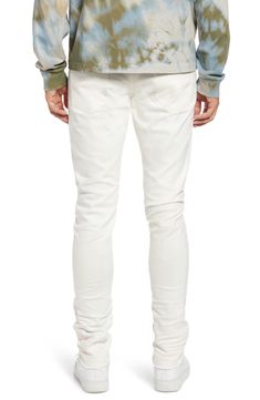 Crisp white Japanese-denim jeans are cut in a skinny fit with a hint of stretch that allows you to move freely and comfortably in these five-pocket jeans. 32 1/2" inseam; 13" leg opening; 10 1/2" front rise; 14" back rise (size 32) Zip fly with button closure Five-pocket style 98% cotton, 2% polyurethane Machine wash, line dry Made in Japan Men's Clothing Fitted White Jeans With Five Pockets, Casual Fitted White Jeans, Slim Fit White Cotton Bottoms, White Slim Fit Cotton Bottoms, White Tapered Leg Jeans, White Cotton Slim Fit Bottoms, White Five-pocket Jeans For Fall, White Jeans With Five Pockets For Fall, White Stretch Bottoms With Five Pockets