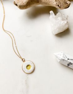 ABOUT THIS PIECE: Handcrafted sunshine necklace. Hand stamped, baked and painted. Completed on a delicate 16" cable chain, with a 2" extender. Pendant is 18mm. 14k gold vermeil. Vermeil is a tarnish resistant material that has a 925 sterling silver base metal and is coated in 2.5 micron thickness of 14k gold.  This is an absolutely beautiful everyday piece.  Looks great on its own or layered with other necklaces. Here are the other products in my shop:  https://www.etsy.com/ca/shop/RubyBlueCo SH Tiny Gold Necklace, Gold Sun Necklace, Gold Necklace Dainty, Sunshine Necklace, Sun Necklace, Gold Sun, Personalized Pendant, Necklace Charm, Layering Necklace