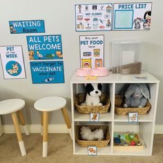 a room with toys and signs on the wall, including stuffed animals in baskets next to two stools