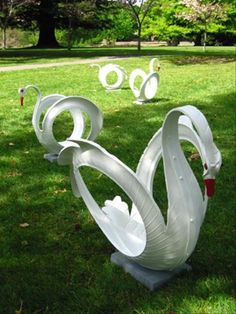 an image of some sculptures in the grass