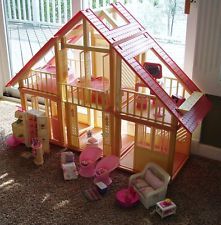 a doll house with furniture and accessories on the floor