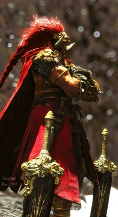 a man dressed in red and gold holding two swords