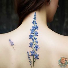 a woman with blue flowers on her back