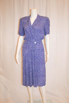 "80s graphic pattern of white on periwinkle blue Maggie London Petites Dress by Jeannene Booher Lovely flattering feminine style with an edgy 80s print Faux wrap style with snap and button closure at waist Small shoulder pads which could be snipped out to remove 100% Rayon Size 8 Measures laying flat: 17\" armpit to armpit, 13.5\" across waist, 17\" shoulder to waist, 26\" from waist to hem Condition: Very Good Vintage Condition" 80s Print, Periwinkle Blue, Petite Dresses, Graphic Patterns, Dress Clothes For Women, Feminine Style, Wrap Style, Shoulder Pads, Dress To Impress