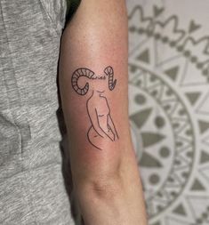 a person with a tattoo on their arm