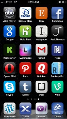 an iphone screen with many different apps on the phone and in front of it, there is