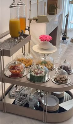 an assortment of desserts and drinks on a serving tray