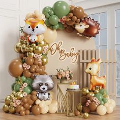 a baby shower with balloons and animals on the wall