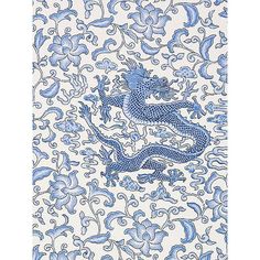 a blue and white dragon pattern on a wall