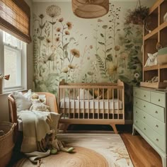 a baby's room with a crib, dresser and wallpaper that has flowers on it