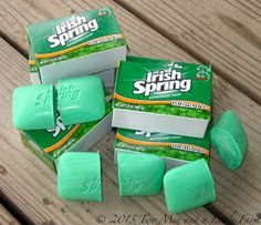 four boxes of irish spring soap sitting on top of a wooden table