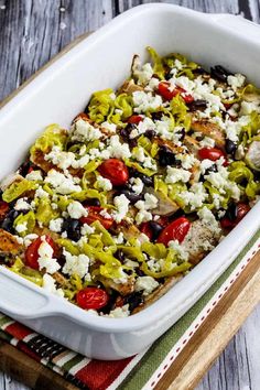 an easy low carb greek chicken bake in a white casserole dish