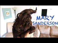 a woman with long hair sitting in front of a couch and the words mary sandersonson on it