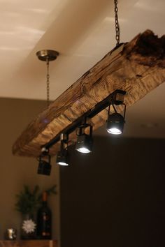 a wooden beam with lights hanging from it