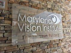 the sign for maryland vision institute in front of a brick wall