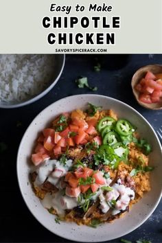 a white bowl filled with chicken and vegetables next to rice on a blue tablecloth