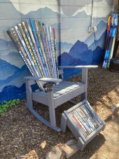 a chair with skis on it next to a wall