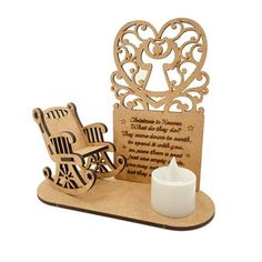 a candle holder with a wooden cutout of a rocking chair and poem on it