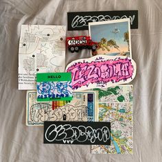 various stickers and pictures on a white sheet