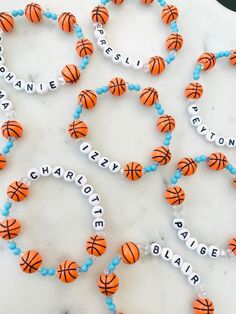 basketball bracelets with name beads on marble surface