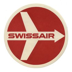 a red and white sticker with the word swiss air in it's center