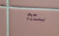 a pink tiled wall with writing on it that says, why am i'm so emotiful?