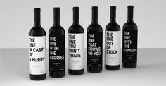 six bottles of wine with black and white lettering on them