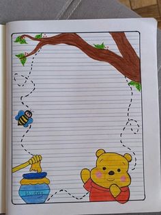 an open notebook with winnie the pooh and honey pot drawn on it's side