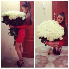 the woman is holding a large bouquet of flowers in her hands and posing for pictures