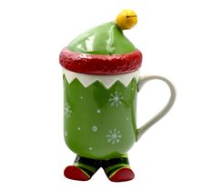 a green christmas mug with a yellow nose