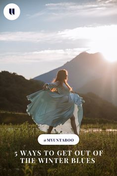 a woman in a blue dress with the sun behind her and text that reads 5 ways to get out of the winter blues