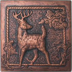 a deer with antlers on it's head is shown in an ornate frame