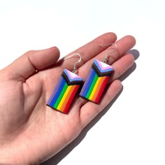 These earrings are made by hand  from premium polymer clay. They are super light weight and the hooks are sterling silver. Pride Clay Earrings, Polymer Clay Pride Earrings, Pride Jewelry Earrings, Funky Rainbow Earrings For Gift, Bisexual Earrings, Funky Rainbow Earrings, Progress Flag, Lgbtq Earrings, Flag Earrings