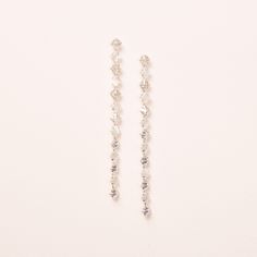 "BRYN DUSTER EARRINGS Duster earrings done right. Our Bryn Duster Earrings are designed with inversely set dangling CZs & white crystals that shimmer beautifully. Perfect for adding drama & lightweight enough to wear all night.  DETAILS * Cubic zirconias & white crystal stones * 3.75\" length; .25\" width * Hypoallergenic, lead-free & nickel-free. * Style #4378 SHOP MORE STYLES https://www.etsy.com/shop/darethcolburndesigns NEED MORE HELP? Happy to offer advice or recommendations, just message m Duster Earrings, Long Gold Earrings, Crystal Dangle Earrings, White Crystals, Long Dangle Earrings, Earrings Crystal, Crystal Stones, Free Style, Earrings Long