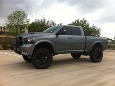 a large gray truck parked in a parking lot