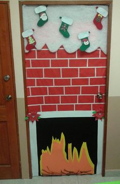 a fireplace decorated with stockings and stockings hanging from the mantle, on top of a red brick wall