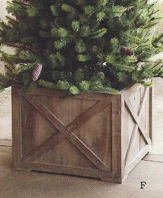 a wooden planter with pine cones on top