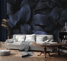 a living room with a white couch and black wallpaper