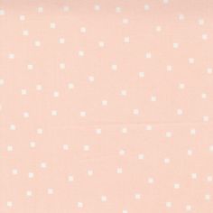 an orange and white wallpaper with small flowers on it's side, as well as dots