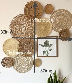 the wall is decorated with wicker baskets and plants