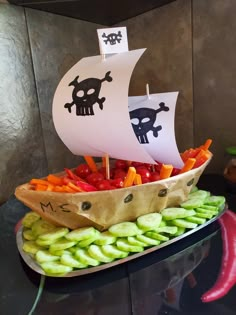 a pirate boat made out of vegetables on a table