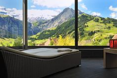 a room with large windows overlooking the mountains