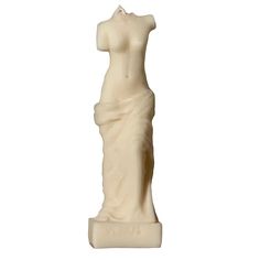 a white statue is shown against a white background with the image of a woman's torso